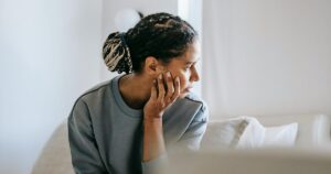 Expectant mother thinking about the support she may need during pregnancy.